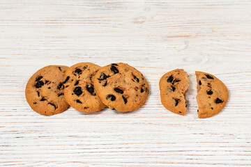 Chocolate chip cookies on a wooden table.