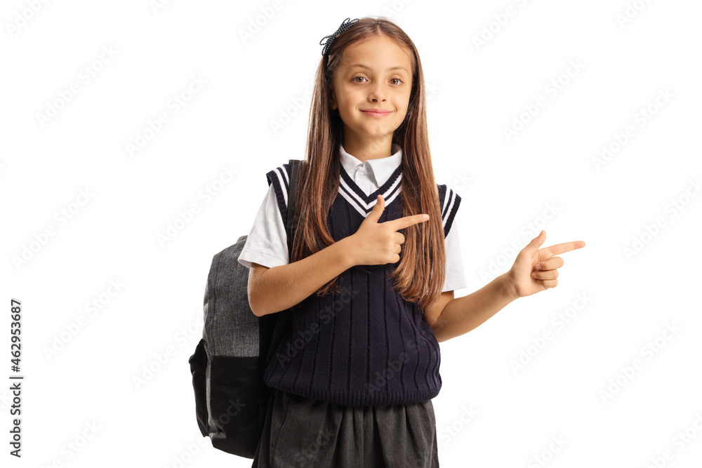 Wall mural Schoolgirl with a backpack and a uniform pointing