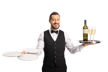 Cheerful waiter carrying wine on a tray and plates