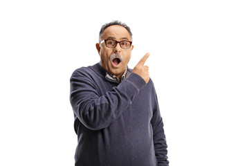 Surprised mature man pointing with finger