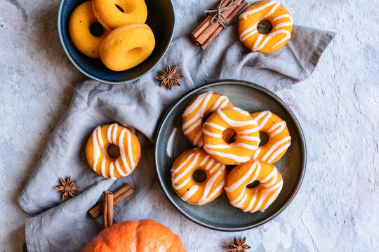 Baked pumpkin donuts topped with lemon sugar glaze