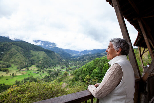 Senior woman at the beautiful view point over the Cocora Valley in Salento, located on the region of Quindio in Colombia