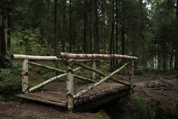 The wooden bridge across the river.
