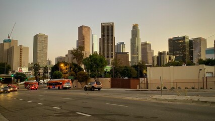 LOS ANGELES, CA, JAN 2021: Downtown skyline seen from a city street to the north, with cars and...