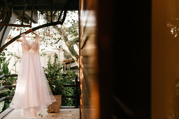 Wedding Dress - White tank top with white lace hanging from the tree, for the bride to wear during her beach wedding