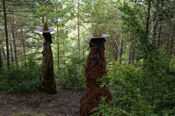 Closeup shot of creepy scarecrows in the forest - the concept of Halloween