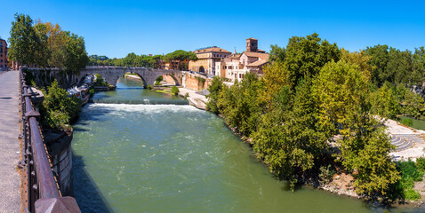 Rome - The Isola Tiberiana - Tiberian Island with the Ponte Cestio bridge.
