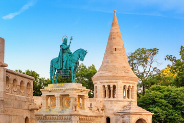 Fototapeta na wymiar View of the equestrian statue of King Saint Stephen I of Hungary against the background of the Fisherman's Bastion in Budapest, Hungary