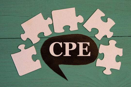 CPE - acronym on a black note on a green background with puzzles