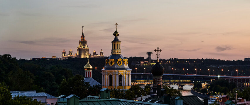 Russia. Moscow after sunset. Panorama of the Moscow State University and the Luzhniki bridge from the observation deck over the Andreevsky Monastery