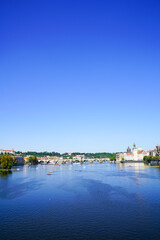 Palacky Bridge with tramlines and cables overlooking Vltava River and city skyline, Prague, Czech Republic.