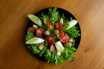 delicious natural mix, colorful tasty salad served on wooden table, top view centered photo
