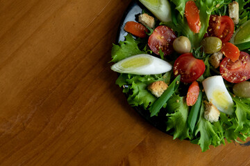 delicious natural mix, colorful tasty salad served on wooden table, top view enlarged photo