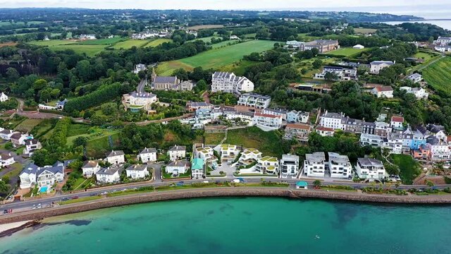 Aerial view of Gorey residential village adjacent to Gorey Harbour. Jersey, CI
