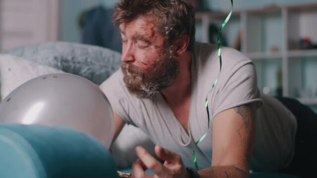 Guy waking up and suffering from hangover