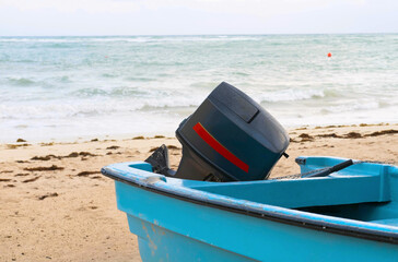 .Blue fishing motor boat on the ocean shore. Close-up. Selective focus.