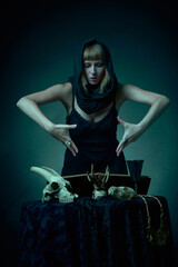 Dark sorceress casting a magic spell with an animal skull