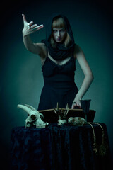 Dark sorceress casting a magic spell with an animal skull