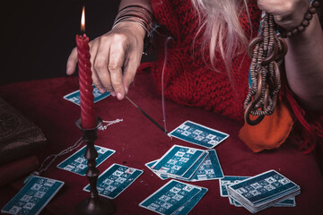 Folklore gypsy tribal soothsayer, chanting spell from her spellbook