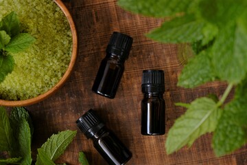 salt with Peppermint extract, Peppermint oil in glass bottles set,salt with mint extract.Natural cosmetics and aromatherapy with mint extract © Yuliya