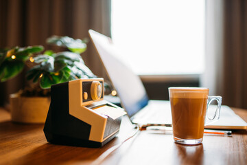 home office desk with a cup of mochacino, a computer and decorative objects