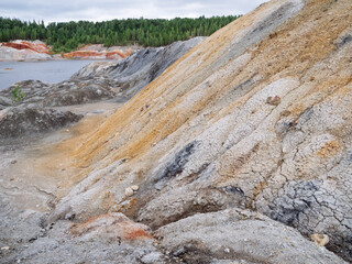 A deposit of refractory clay. A quarry for the extraction of natural resources