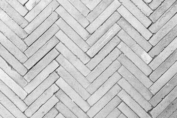 White brick floor texture background. Brickwork or stonework flooring interior rock old pattern clean concrete grid uneven bricks design stack walls