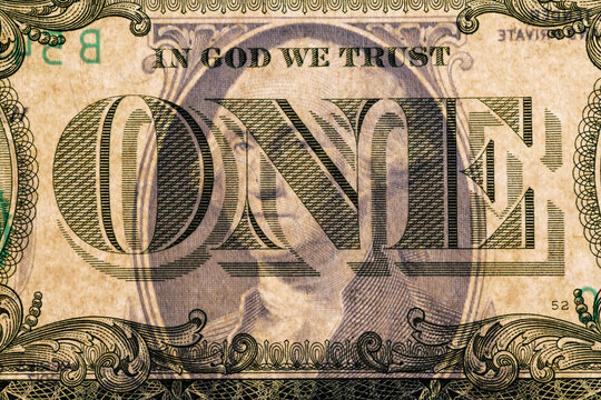 Fragment of one American dollar bill, photographed in light with watermarks and mirrored reverse side