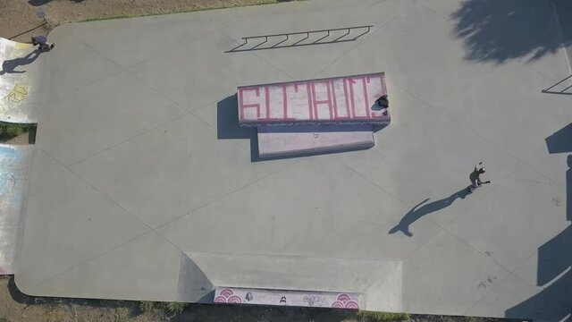 skaters training their tricks outdoor at an amazing sun morning in Cascais