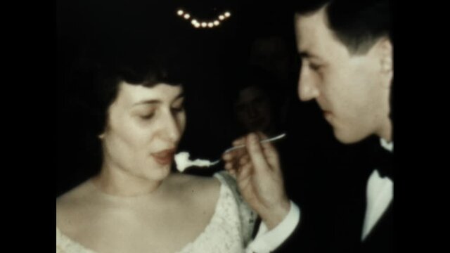 Wedding Cake Bite 1949 - A couple takes a bite of the wedding cake.
