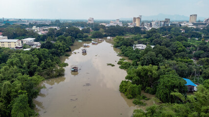 Flood waters overtake a house and rice field at Central of Thailand in 2021. Many buildings are...