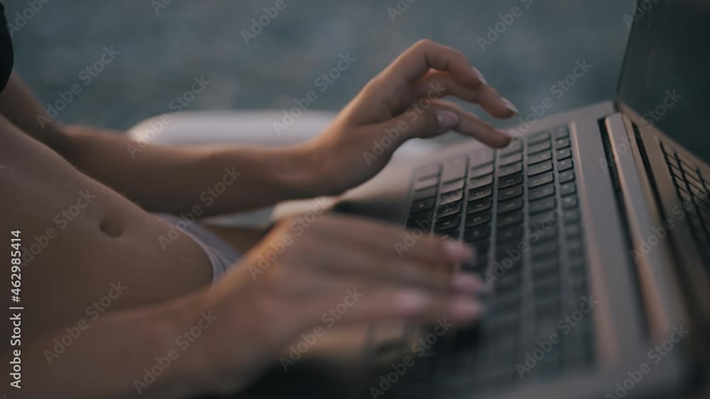 Poster a female freelancer is working on laptop near sea. programmer is coding and surfing on notebook. rem