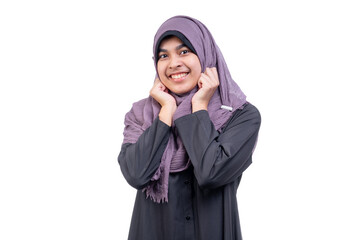 An office worker for an Asian Muslim woman stands with a happy face and a commitment to work, on white background.