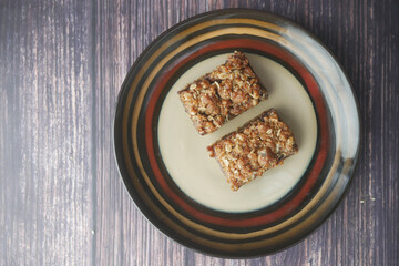 date fruit chocolate bar in a plate on table 