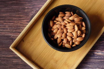 top view of almond nut in a bowl on table 