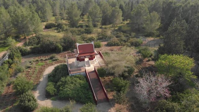 Aerial orbiting over Thai Pagoda Building at remote area of Ben Shemen Forest - Israel