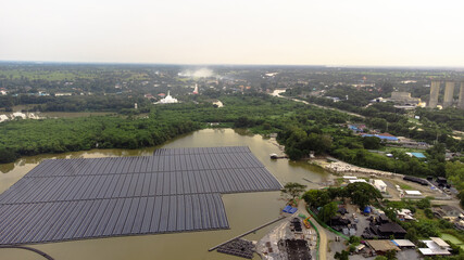 Solar panels on water in aerial view, rows array of polycrystalline silicon solar cells or...