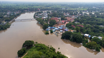 Aerial view of Rama 6 Dam (Phra Narai Gate) in Thailand with powerful of water. During Flood...
