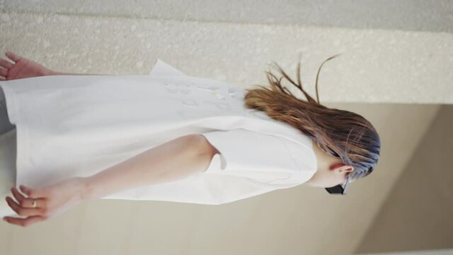Vertical: woman's high-fashion, trendy summer clothing model shoot