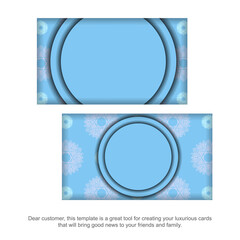 Blue business card with vintage white ornament for your contacts.