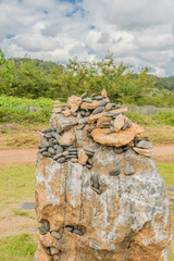 Small rocks stacked on top of larger boulder