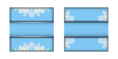 Light blue postcard with Indian white pattern is ready for printing.