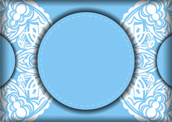 The brochure in blue with a mandala in a white pattern is prepared for typography.
