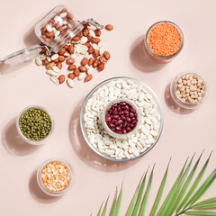 Vegan protein source. Beans, peas, chickpeas, lentils, mung bean, peanut in bowl on beige background.
