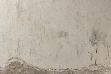 Old ugly ruined white concrete wall