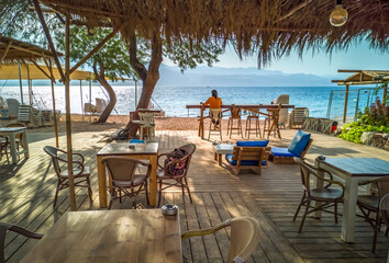 Wooden flooring area with cafe on a beach of the Red Sea
