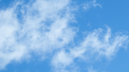 Background of blue sky with white clouds.