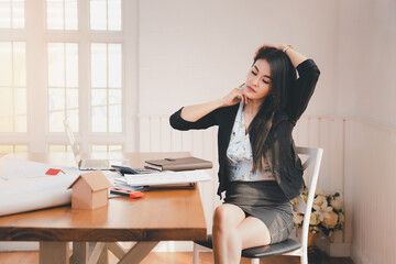 Office syndrome concept. Business Woman twisting the body to relieve fatigue , suffering from pain...