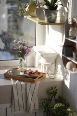 Breakfast on a tray on a sunny balcony