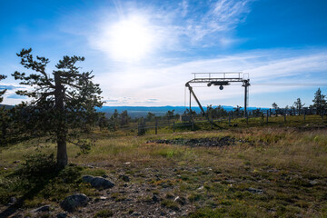 Fototapeta na wymiar Landscape from the top of Lapland with skiing lift in the background